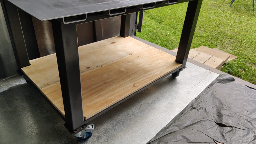 Steel workbench with removable cut-off saw.